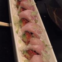 Buddha and Zen Roll · Spicy tuna, spicy lobster and avocado inside, topped with slices of yellowtail and scallions.