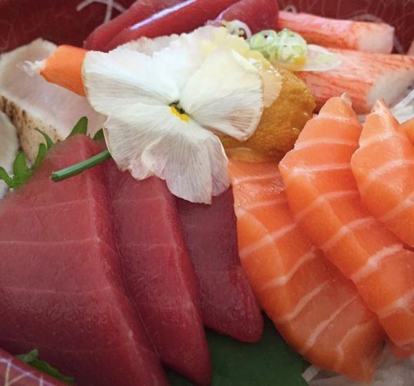 Chirashi Entree · 20 pieces of sashimi, over sushi rice. Served with your choice of soup or salad.
