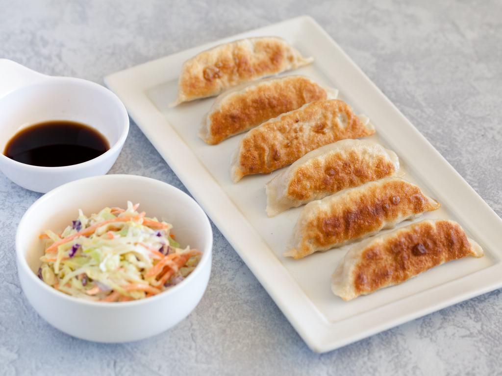Pot Sticker (Chicken) · Delicately hand-folded dumplings are crispy pan-fried, filled with ground chicken and fresh cabbage pair perfectly with our house-made pot sticker sauce