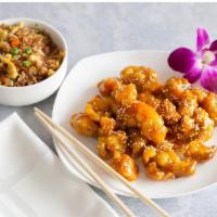 Honey Chicken + Fried Rice · Fried chicken meat tossed in house made honey sauce topped sesame seeds. Served with a side ...