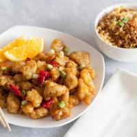 Orange Chicken + Fried Rice · Crispy fried white meat chicken tossed in zesty and sweet orange sauce. Served with a side o...