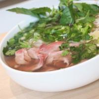 Pho Noodle Soup · Green onion, white onion, cilantro, bean sprouts, basil, jalapeno, and lime in our homemade ...