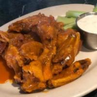 Arturo Wings · A combination of our BBQ and spicy Buffalo sauce with celery and blue cheese.