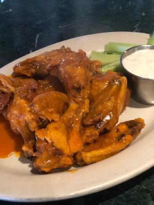 Arturo Wings · A combination of our BBQ and spicy Buffalo sauce with celery and blue cheese.