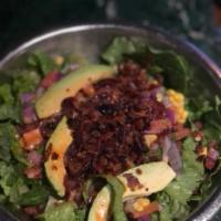 Spicy Southwestern Salad · Romaine with avocado, bacon, corn, tomato, and onion with lime chipotle vinaigrette.