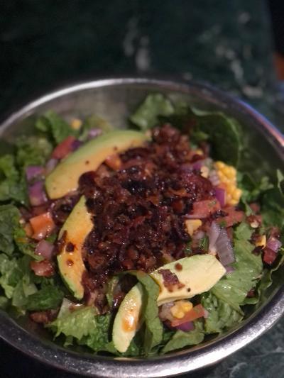 Spicy Southwestern Salad · Romaine with avocado, bacon, corn, tomato, and onion with lime chipotle vinaigrette.