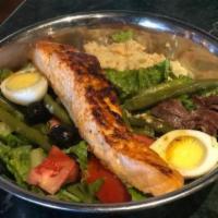 Salad Nicoise with Grilled Salmon · Romaine lettuce, string beans, tomatoes, Nicoise olives, hard-boiled egg, anchovies, and our...