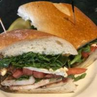 Grilled Chicken and Arugula Sandwich · Topped with fresh mozzarella and balsamic.