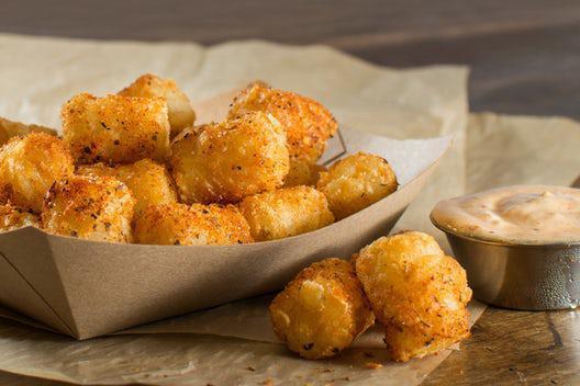 Cajun Tater Tots · Crispy tater tots tossed in cajun seasoning with a creole remoulade dipping sauce!
