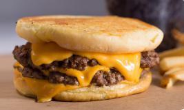 Cheeeesy Burger · 2 fresh, 100% all beef patties and 4 slices of American cheese on a grilled buttered bun.