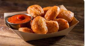 Mac and Cheese Bites · 8 fried macaroni and cheese bites with your choice of dipping sauce.