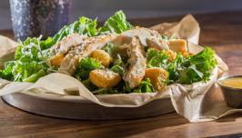 Caesar Salad · Crisp lettuce, grilled chicken, shredded Parmesan, croutons and Caesar dressing.