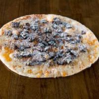 Dessert Pizza. · Butter, cinnamon, icing, powdered sugar, caramel and Oreo cookie crumbles.