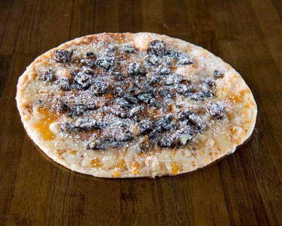 Dessert Pizza. · Butter, cinnamon, icing, powdered sugar, caramel and Oreo cookie crumbles.