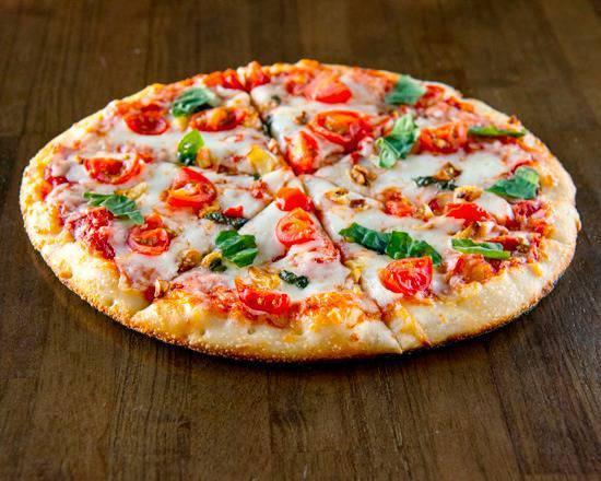 Margherita Pizza · Organic tomato sauce, fresh shredded mozzarella, cherry tomatoes, roasted garlic and basil.