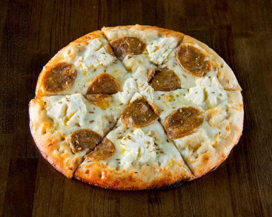 Fennel and Sausage Pizza · Olive oil, fresh shredded mozzarella, ricotta, sweet fennel sausage and fennel seeds.