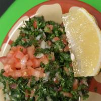 Tabbouli Salad · Finely chopped parsley, onions, tomato combines with cracked wheat tossed with our specialty...