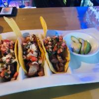 Chifrijo Tacos · Three soft corn tortillas filled with pork and beans. Topped with pico de gallo and
avocado.
