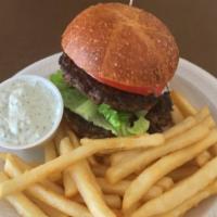 JJ's Burger · Seasoned ground beef served with lettuce, onions, tomatoes and tzaziki sauce.
