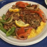 Souvlaki Plate · Marinated tender pieces of pork loin topped with chopped onions, green peppers, tomatoes and...