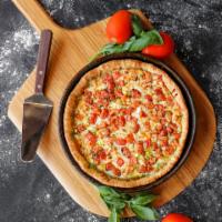4 Cheese and Pesto Deep Dish Pizza · Mozzarella, feta, cheddar, Romano and basil pesto sauce topped with diced tomatoes.