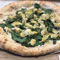 Iggy Popeye Pizza · White pizza with fresh spinach, artichokes, and tofu ricotta.