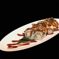 Volcano Roll · Crab mix, avocado, cucumber topped with baked scallop, kani, scallion, and eel sauce.