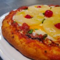Hawaiian Pizza · House made sauce, Pineapple Rings, Ham, and Scallions Served on a 10