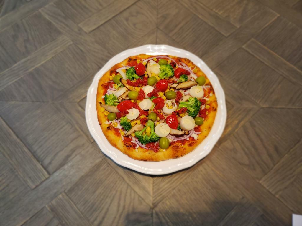 Jungle Veggie Pizza · House Made Sauce, Mozzarella, Broccoli, Shiitake Mushrooms, Sundried Tomatoes, Sweet Picante Peppers, Roasted Corn, and Red Onions Served on a 10