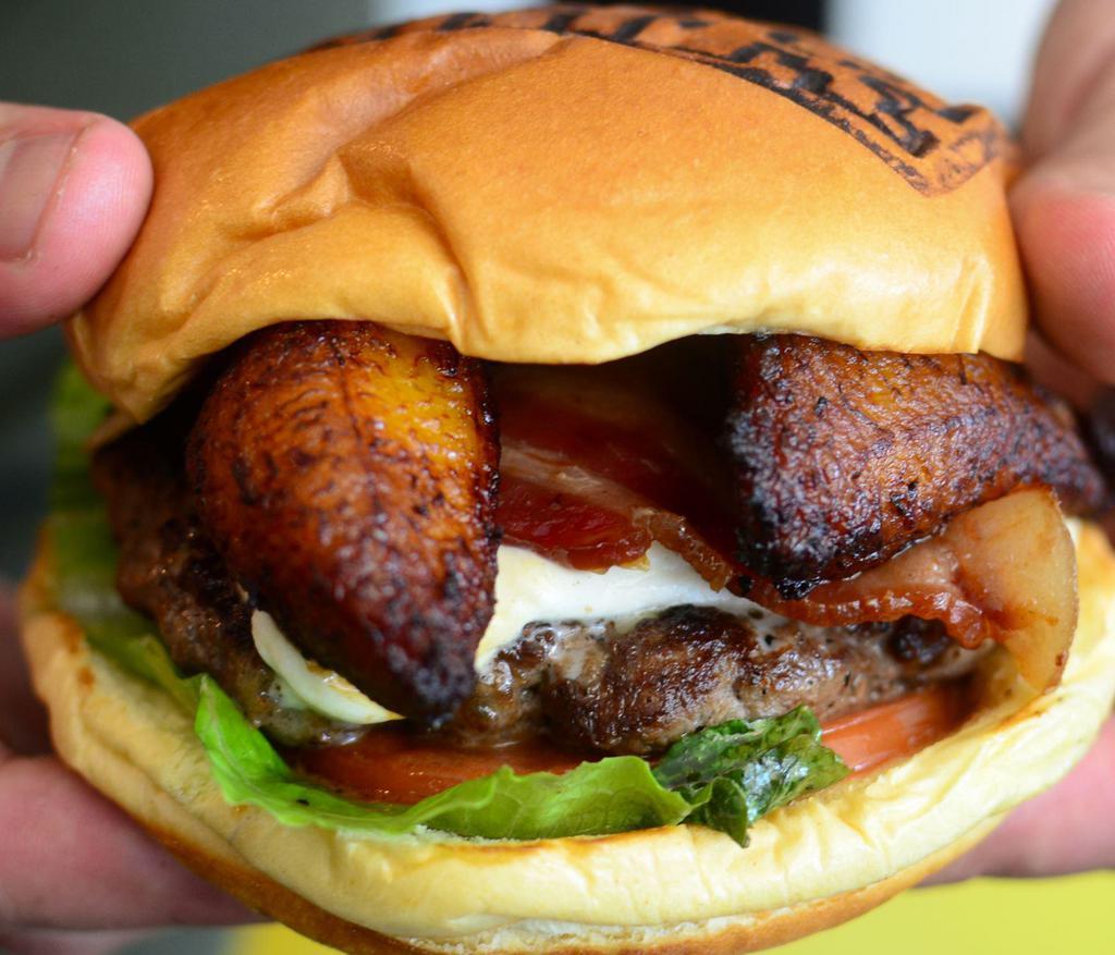 OH MY ... SWEET PLANTAIN Burger · Angus Beef, melted mano cheese and sweet plantains.