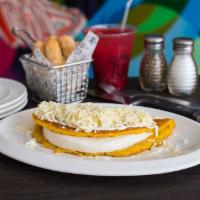 Mano Cheese Cachapa · A sweet corn pancake filled with cheese and topped with nata and white cheese.