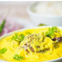 Punjab Kadi · Homemade yogurt cooked in gram flour with Indian spices, onion, cardamom seeds, ginger, garl...