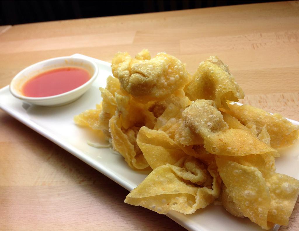 04. Fried Wonton 炸雲吞 · Shrimp and pork wrap in wonton skin, deep fried serve with vinaigrette.