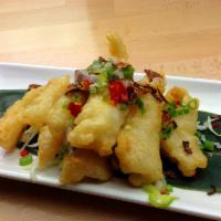 23. Salt Pepper Calamari 椒鹽魷魚 · Fresh cut squid blanched batter coated deep fried gentle heat toss salt pepper mix.