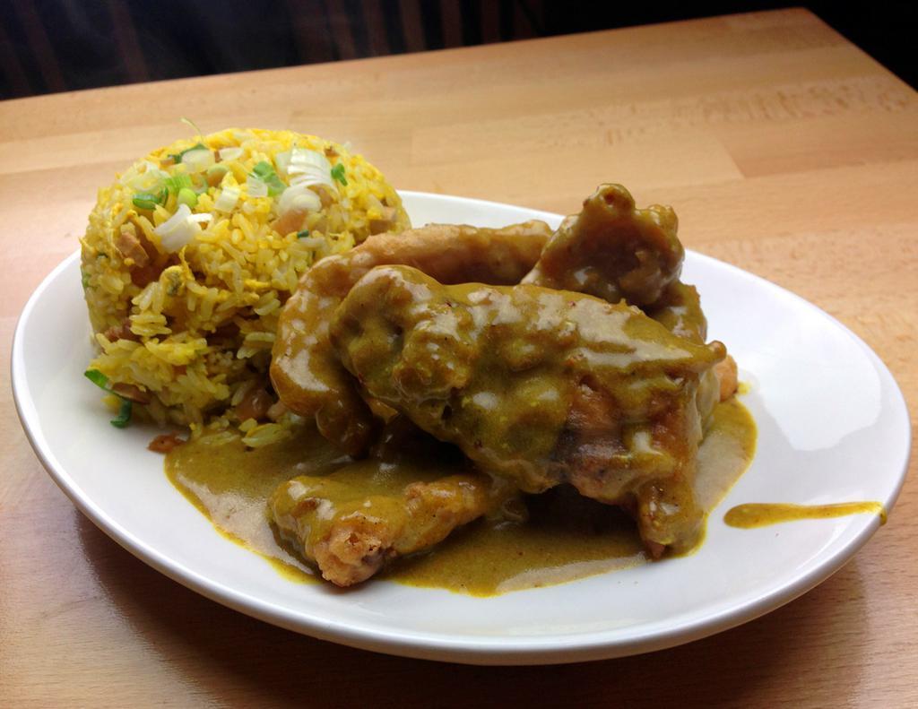63. Curry Pork Chop Fried Rice 咖喱豬扒炒飯 · Marinated pork chop batter coated deep fried glaze with rich coconut nutty curry around high heat fast wok toss nee with a touch of shoyu flavor.