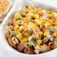Farmer's Skillet · Two scrambled eggs, ham, crumbled sausage, onions, bell peppers, on a bed of seasoned home f...