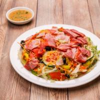 Mitchell's Famous Antipasto Salad · Garden salad covered with capicola, premium ham, Genoa salami, pepperoni and pepperoncinis.