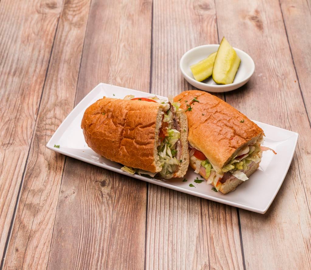 Ultimate Sub · All natural USDA choice roast beef, roasted turkey breast, premium ham, and melted provolone.