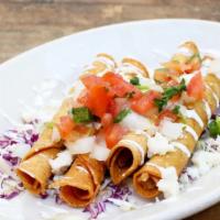 Taquitos de Papa · Four crispy rolled tortillas filled with potatoes and cheese. Served with salsa fresca, sour...