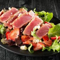 Ahi Tuna Salad · Grilled or blackened ahi tuna steak, feta cheese, strawberries, tomatoes on our spring mix w...