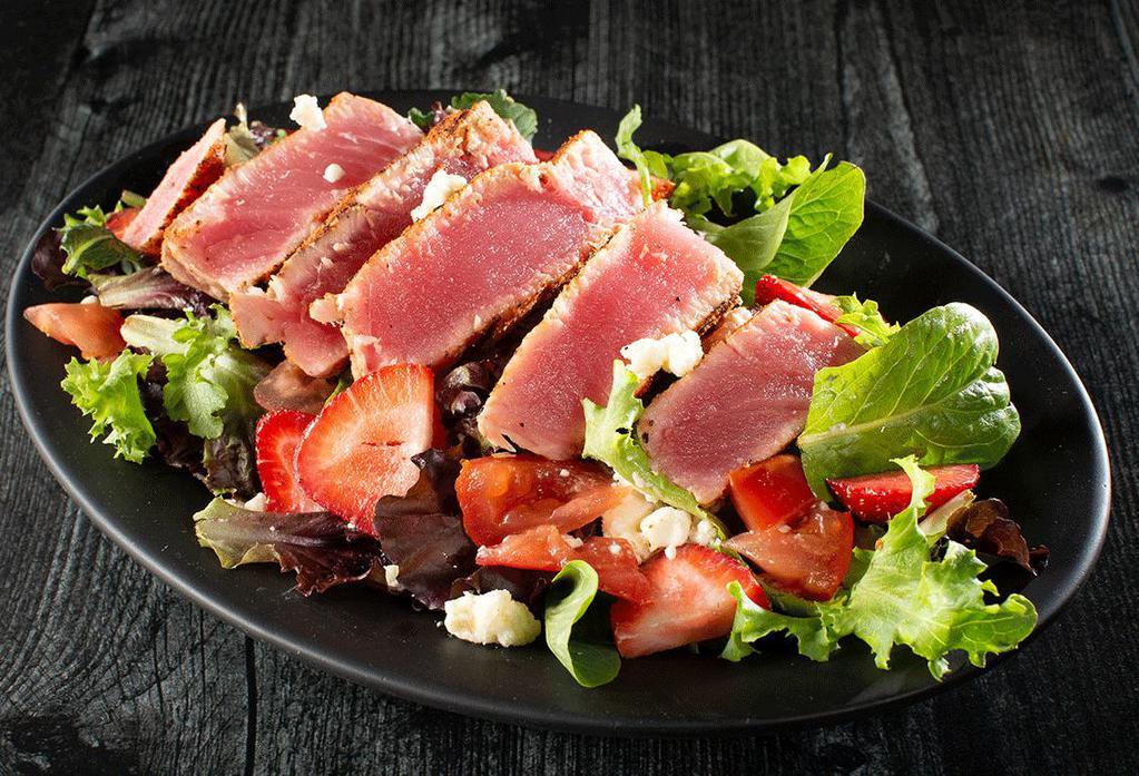 Ahi Tuna Salad · Grilled or blackened ahi tuna steak, feta cheese, strawberries, tomatoes on our spring mix with balsamic dressing.