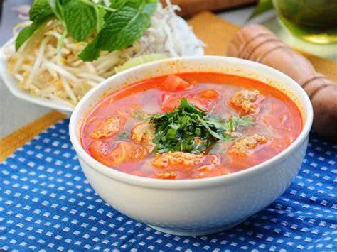 Bun Rieu · Rice Vermicelli noodles with ground pork, egg, fried tofu, tomato and crab paste soup