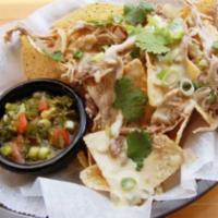 Pork Nachos · Tortilla chips loaded with IPA braised pork shoulder, smothered in house white queso and top...