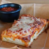 Thick Crust pizza by the slice · In house made rectangle 