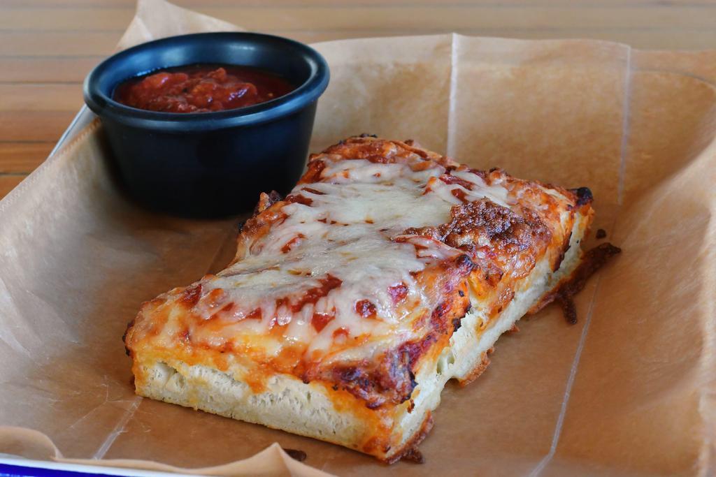 Thick Crust pizza by the slice · In house made rectangle 