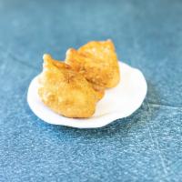 Vegetable Samosas · Two pieces. Deep fried crisp pastry filled with mixed vegetables. Served with mint sauce and...
