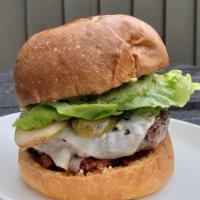 Beef Burger · Herb Aioli, Goat Gouda, Bibb Lettuce, Tomato Jam, Dill Pickle, Brioche Bun
