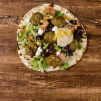 The Veggie Wrap · Falafel, Greek Salad, Organic Greens, and Hummus.  Vegetarian.