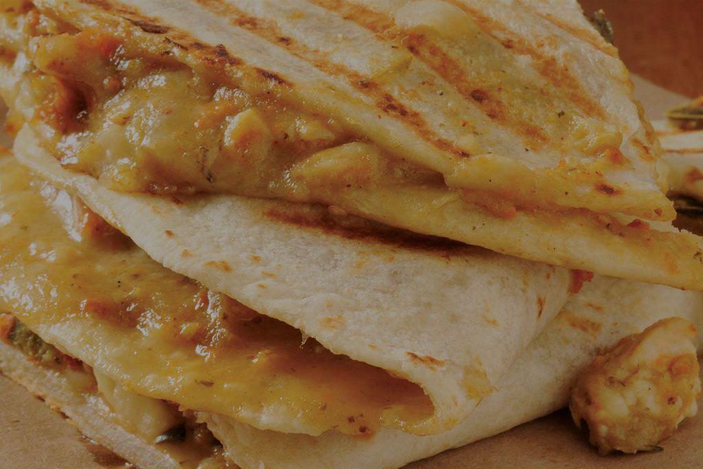Quesapita + Protein · Pita bread filled with your choice of cheese and choice of protein, grilled and cut into slices. Served with your choice of 1 dipping sauce.
