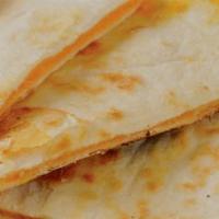 Quesapita · Pita bread filled with your choice of cheese, grilled and cut into slices. Served with your ...